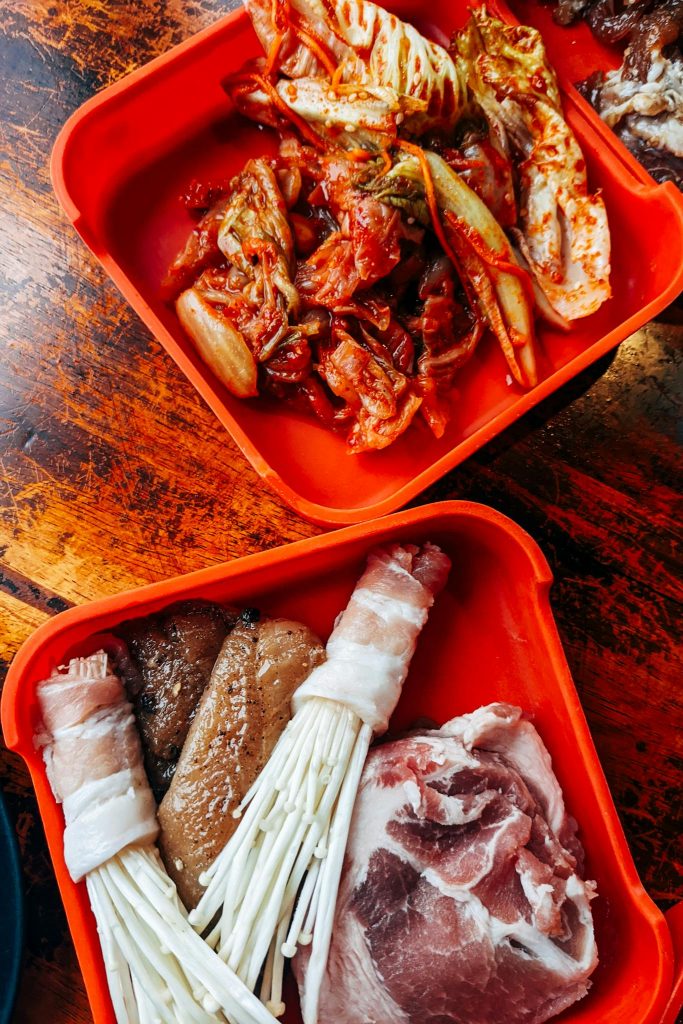 Raw Meat on Red Plastic Container